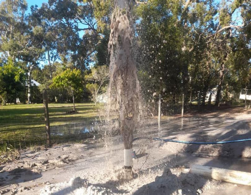 Water and mud flowing — Bore Drilling in Hervey Bay, QLD